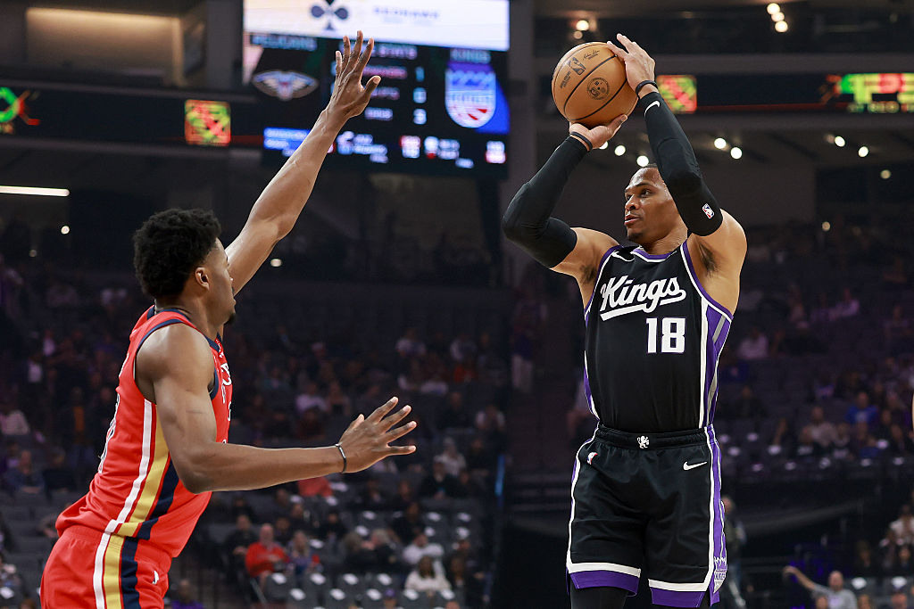 SACRAMENTO, CALIFORNIA - MARCH 05: Russell Westbrook #18 of the Sacramento Kings shoots over Yves M...