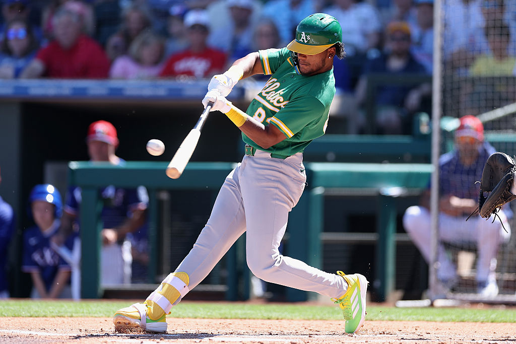 SURPRISE, ARIZONA - MARCH 12: Leo de Vries #83 of the Athletics bats against the Texas Rangers duri...