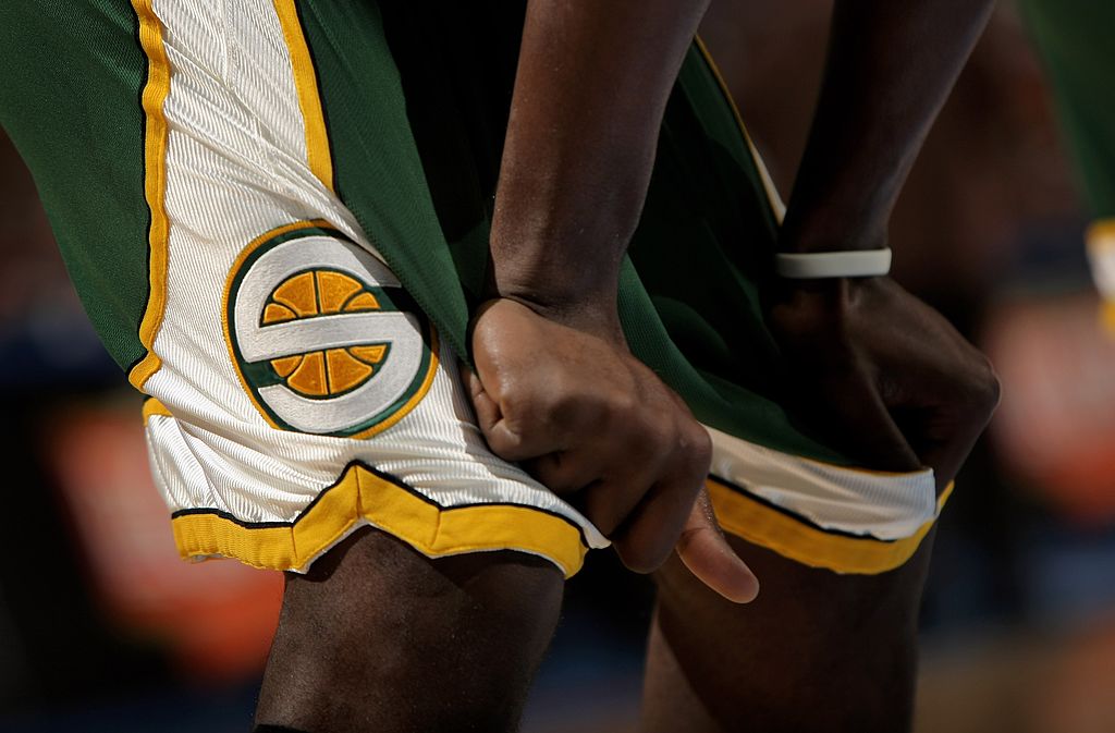 DENVER - MARCH 16: A member of the Seattle SuperSonics awaits action against the Denver Nuggets at ...