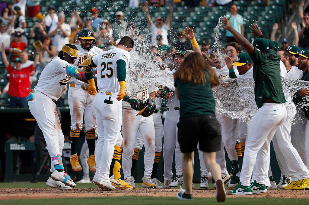SACRAMENTO, CALIFORNIA - APRIL 05: The Athletics celebrate a walk-off two-run home run off the bat ...