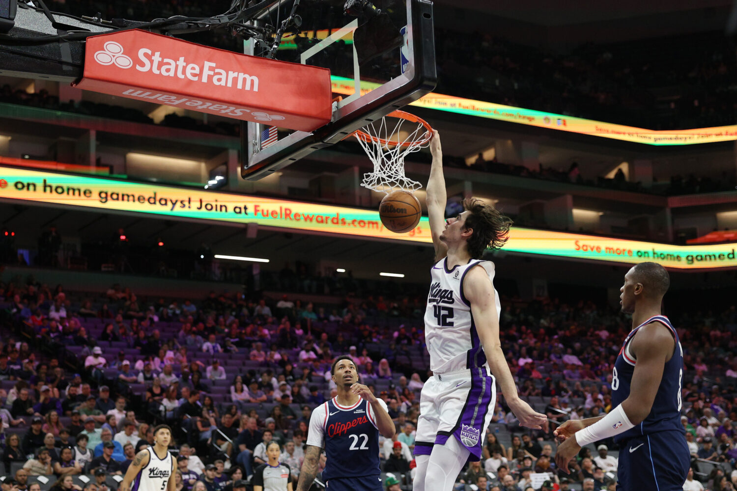 SACRAMENTO, CALIFORNIA - APRIL 05: Maxime Raynaud #42 of the Sacramento Kings dunks the ball during...