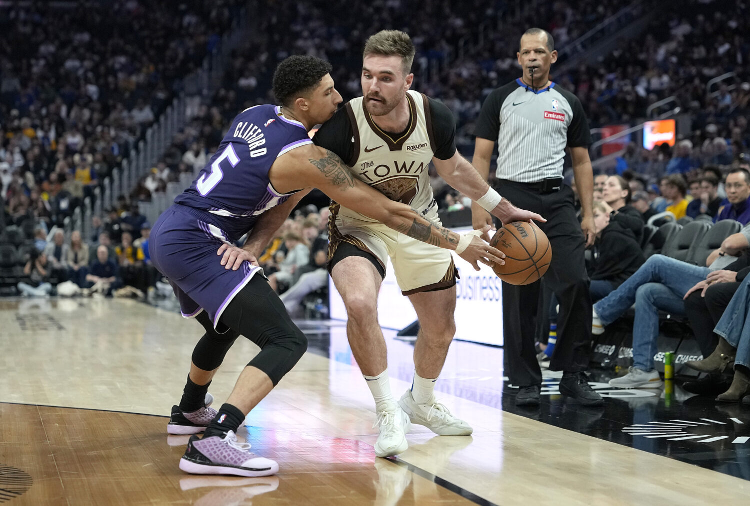 SAN FRANCISCO, CALIFORNIA - APRIL 07: Nique Clifford #5 of the Sacramento Kings steals the ball fro...