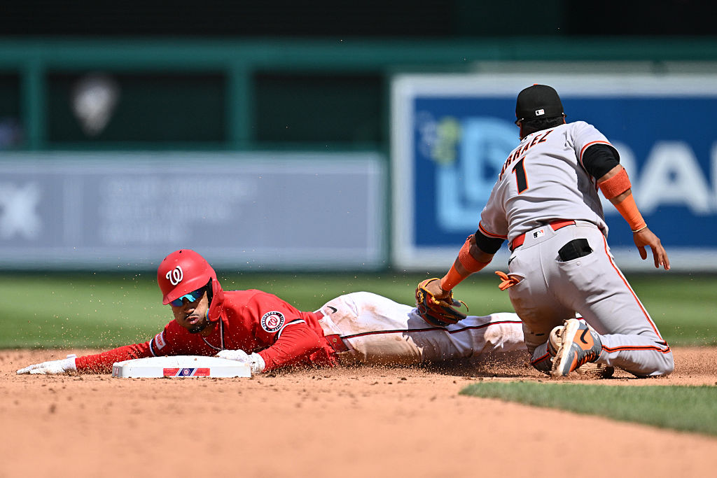 WASHINGTON, DC - APRIL 19: Nasim Nunez #26 of the Washington Nationals steals second base in the fi...
