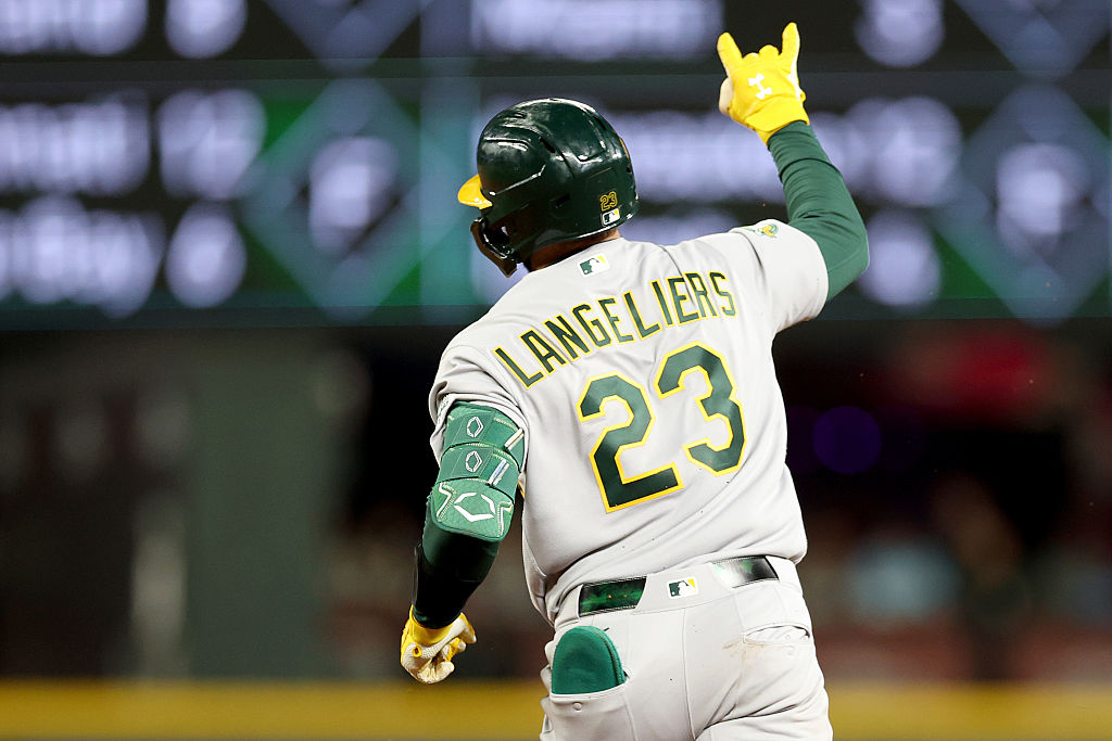 SEATTLE, WASHINGTON - APRIL 21: Shea Langeliers #23 of the Athletics reacts after his solo home run...