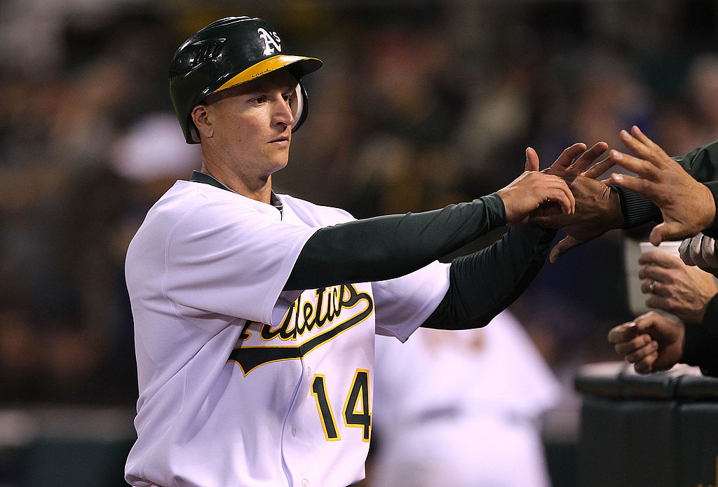 OAKLAND, CA - APRIL 05: Mark Ellis #14 of the Oakland Athletics celebrates after scoring in the sev...