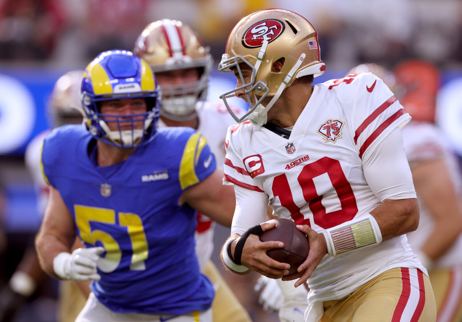 INGLEWOOD, CALIFORNIA - JANUARY 09: Jimmy Garoppolo #10 of the San Francisco 49ers scrambles away f...