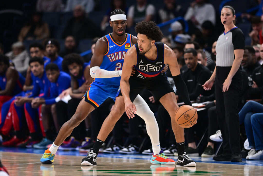 OKLAHOMA CITY, OKLAHOMA - OCTOBER 30: Cade Cunningham #2 of the Detroit Pistons handles the ball while being defended by Shai Gilgeous-Alexander #2 of the Oklahoma City Thunder at Paycom Center on October 30, 2023 in Oklahoma City, Oklahoma. Teams the Kings could model. NOTE TO USER: User expressly acknowledges and agrees that, by downloading and or using this photograph, User is consenting to the terms and conditions of the Getty Images License Agreement. (Photo by Joshua Gateley/Getty Images)
