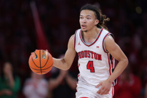 HOUSTON, TEXAS - MARCH 04: Kingston Flemings #4 of the Houston Cougars brings the ball up court against the Baylor Bears during the second half at Fertitta Center on March 04, 2026 in Houston, Texas. (Photo by Alex Slitz/Getty Images)