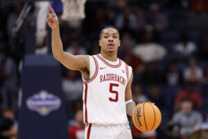 NASHVILLE, TENNESSEE - MARCH 14: Darius Acuff Jr. #5 of the Arkansas Razorbacks looks on during the first half against the Ole Miss Rebels in the semifinal game of the 2026 SEC Men's Basketball Tournament at Bridgestone Arena on March 14, 2026 in Nashville, Tennessee. (Photo by Johnnie Izquierdo/Getty Images)