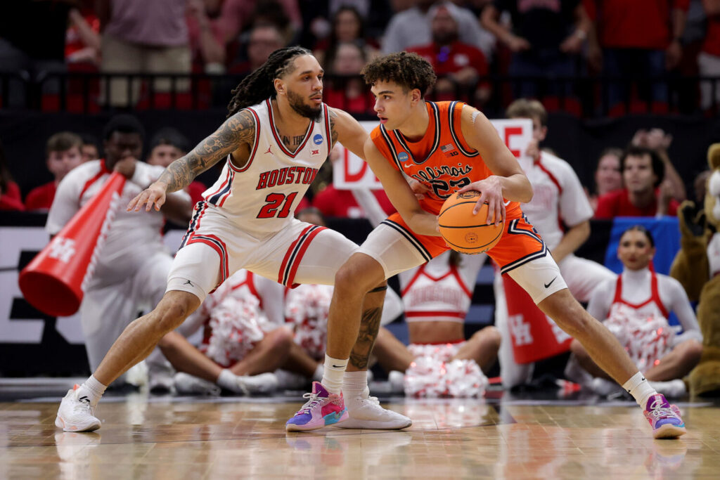 HOUSTON, TEXAS - MARCH 26: Emanuel Sharp #21 of the Houston Cougars defends Keaton Wagler #23 of the Illinois Fighting Illini during the first half in the Sweet Sixteen of the 2026 NCAA Men's Basketball Tournament at Toyota Center on March 26, 2026 in Houston, Texas. (Photo by Alex Slitz/Getty Images)