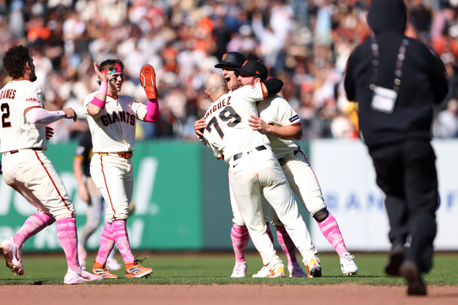 SAN FRANCISCO, CALIFORNIA - MAY 10: Jesus Rodriguez #79 of the San Francisco Giants is embraced by ...