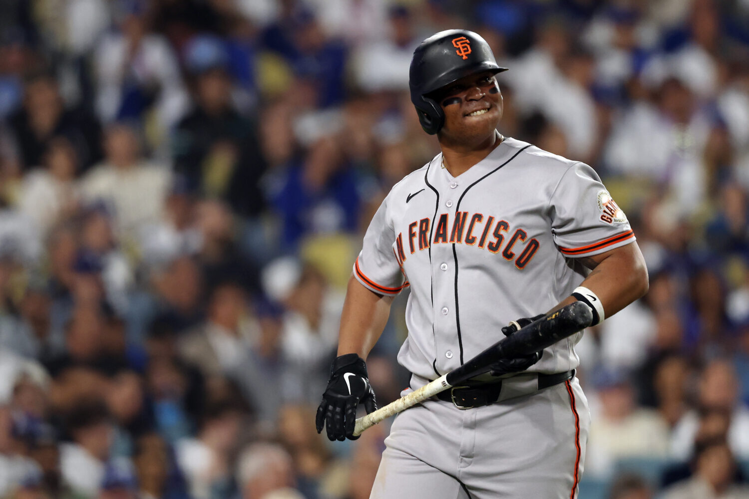 LOS ANGELES, CALIFORNIA - MAY 13: Rafael Devers #16 of the San Francisco Giants reacts after striki...