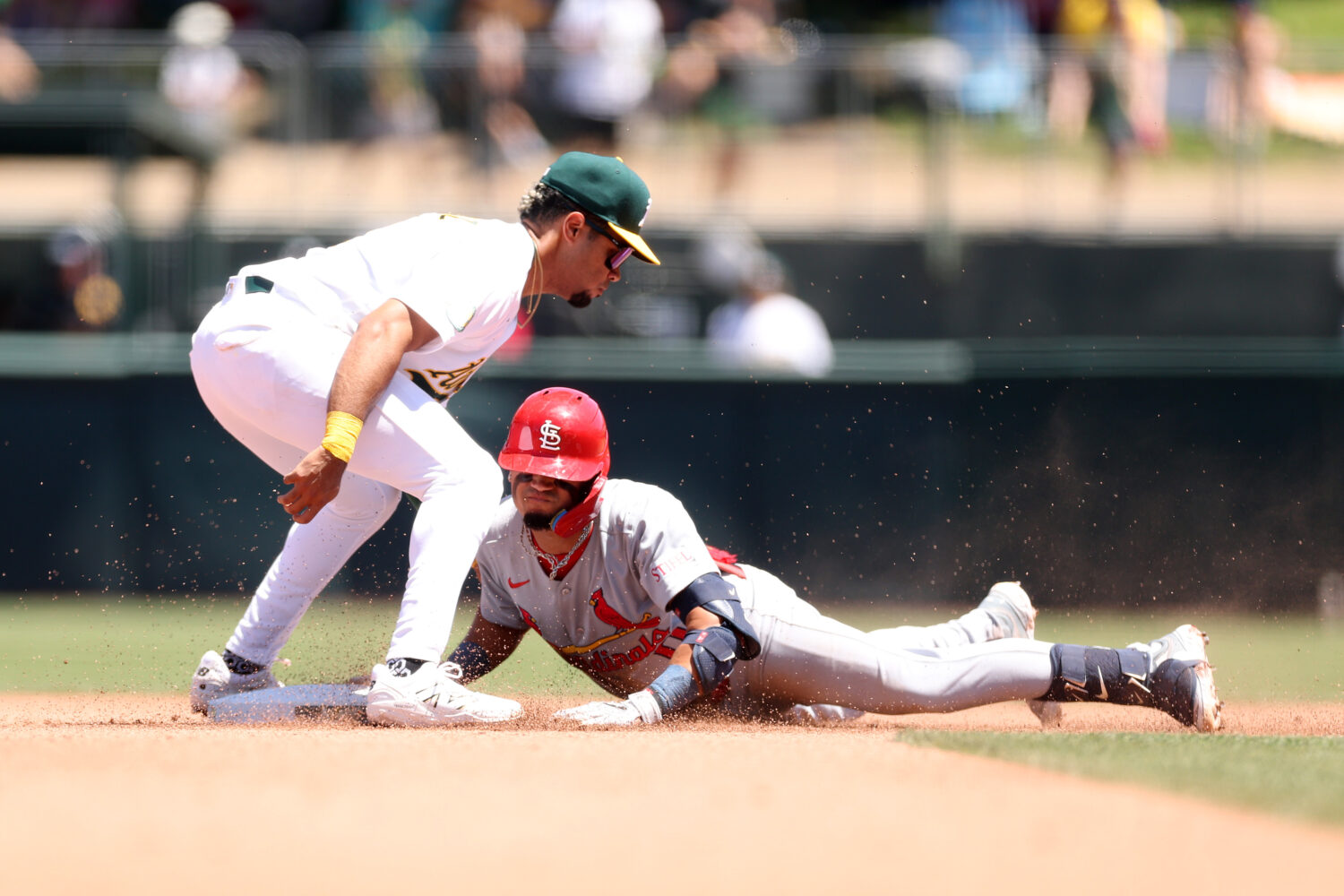 SACRAMENTO, CALIFORNIA - MAY 14: Masyn Winn #0 of the St. Louis Cardinals slides safely into second...
