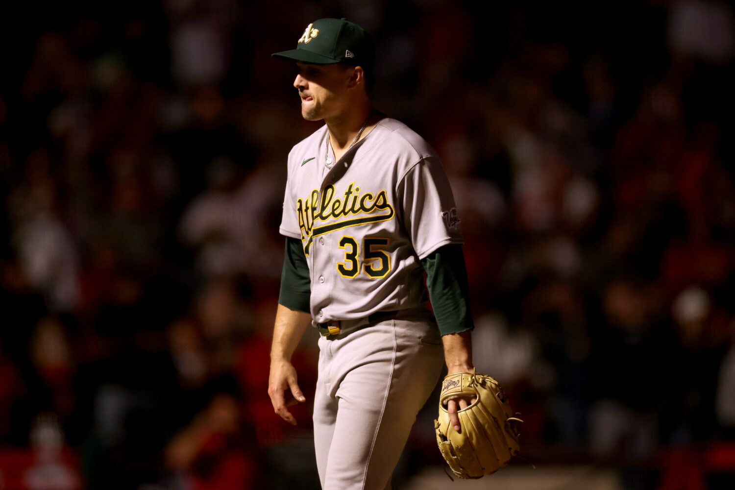 ANAHEIM, CALIFORNIA - MAY 18: J.T. Ginn #35 of the Athletics reacts after giving up a walk-off home...