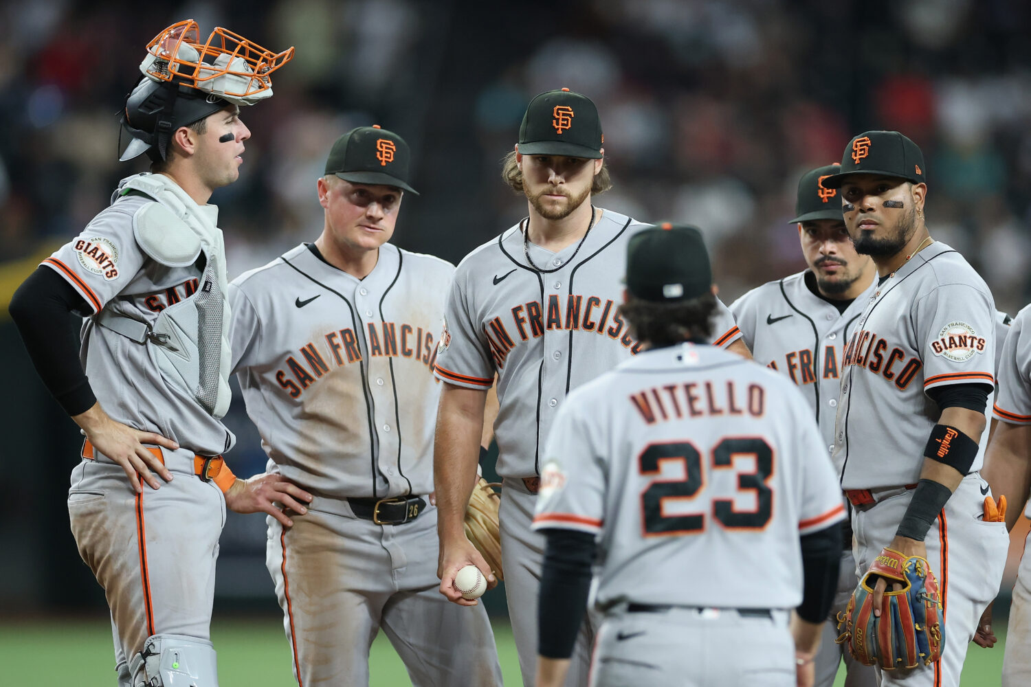 PHOENIX, ARIZONA - MAY 19: Starting pitcher Landen Roupp #65 (c) of the San Francisco Giants reacts...
