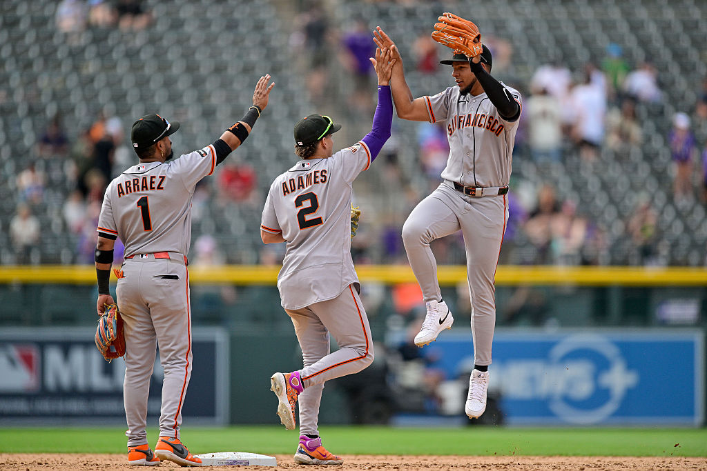 DENVER, COLORADO - MAY 31: Victor Bericoto #78 of the San Francisco Giants jumps as he celebrates t...