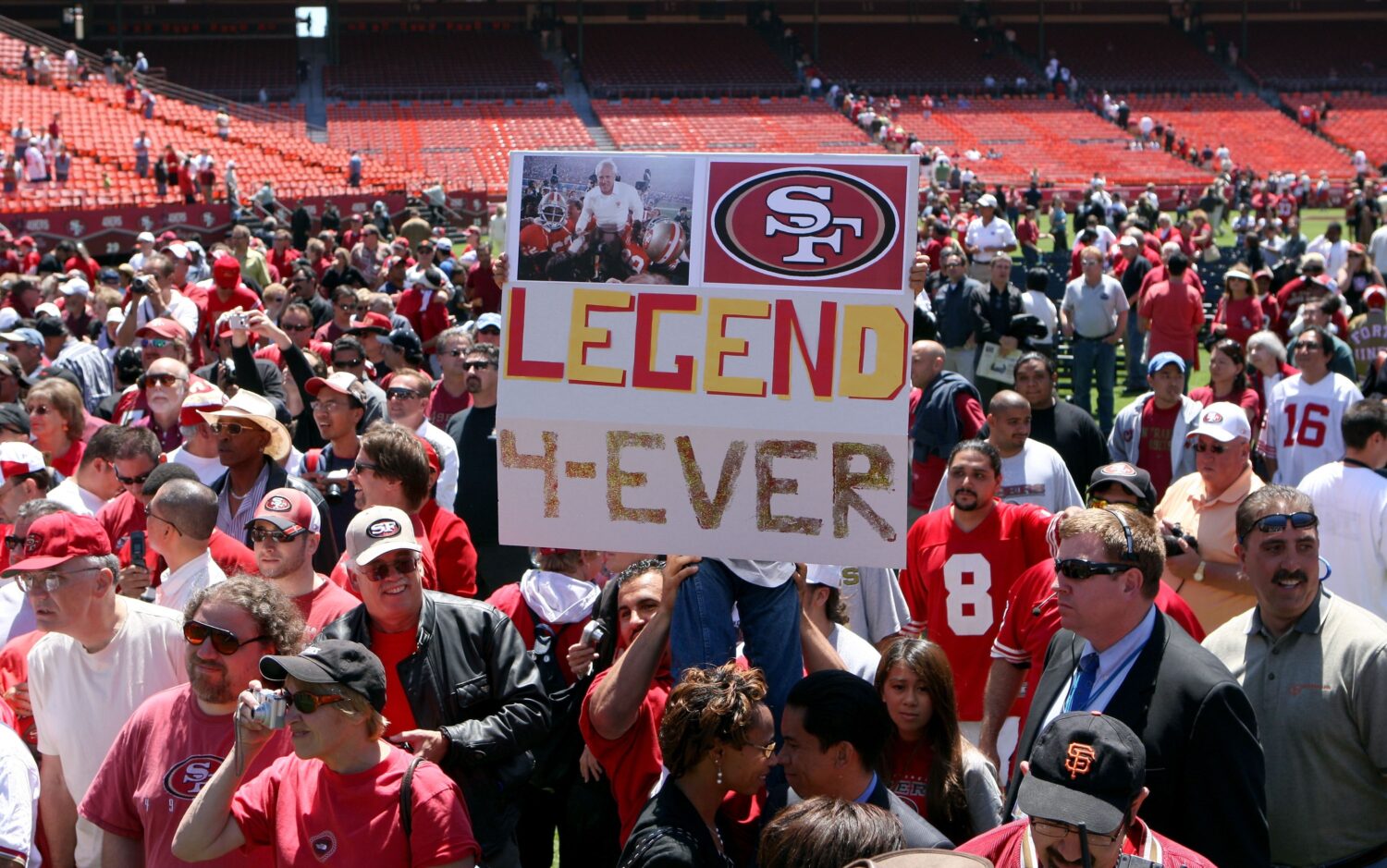 SAN FRANCISCO - AUGUST 10: San Francisco 49ers fans hold a sign during a public memorial for former...