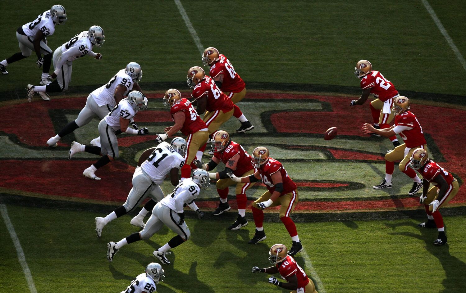 SAN FRANCISCO - AUGUST 22: Alex Smith #11 hikes the ball against the Oakland Raiders during a prese...