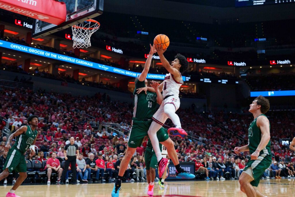 LOUISVILLE, KENTUCKY - NOVEMBER 15: Mikel Brown Jr. #0 of the Louisville Cardinals goes in for a layup against Aidan Hadaway #10 of the Ohio Bobcats at KFC YUM! Center on November 15, 2025 in Louisville, Kentucky. (Photo by Chris Carter/Getty Images)