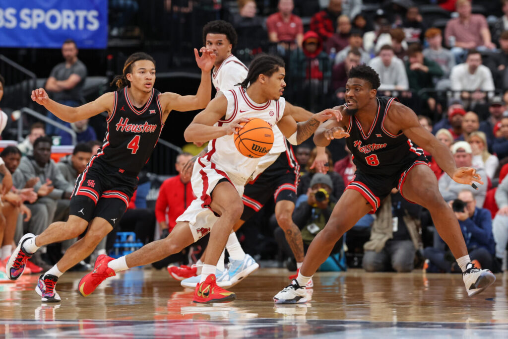 Sactown Scouting Report: Darius Acuff Jr. #5 of the Arkansas Razorbacks dribbles the ball as Kingston Flemings #4 of the Houston Cougars defends during the first half of the Never Forget Tribute Classic at Prudential Center on December 20, 2025 in Newark, New Jersey. (Photo by Ed Mulholland/Getty Images)