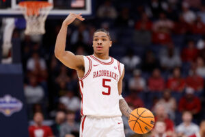 NASHVILLE, TENNESSEE - MARCH 14: Darius Acuff Jr. #5 of the Arkansas Razorbacks looks on during the first half against the Ole Miss Rebels in the semifinal game of the 2026 SEC Men's Basketball Tournament at Bridgestone Arena on March 14, 2026 in Nashville, Tennessee. (Photo by Johnnie Izquierdo/Getty Images)