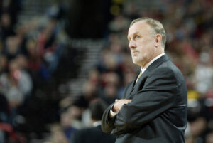 PORTLAND - NOVEMBER 13: Head coach Rick Adelman of the Sacramento Kings folds his arms during the game against the Portland Trail Blazers at the Rose Garden on November 13, 2003 in Portland, Oregon. The Blazers won in overtime 112-110. NOTE TO USER: User expressly acknowledges and agrees that, by downloading and/or using this Photograph, User is consenting to the terms and conditions of the Getty Images License Agreement (Photo by Jonathan Ferrey/Getty Images)