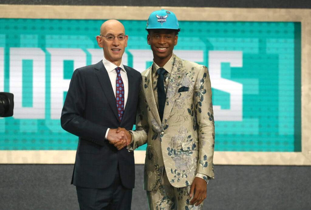 Sactown Scouting Report: Shai Gilgeous-Alexander poses with NBA Commissioner Adam Silver after being drafted eleventh overall by the Charlotte Hornets during the 2018 NBA Draft at the Barclays Center on June 21, 2018 in the Brooklyn borough of New York City. NOTE TO USER: User expressly acknowledges and agrees that, by downloading and or using this photograph, User is consenting to the terms and conditions of the Getty Images License Agreement. (Photo by Mike Stobe/Getty Images)
