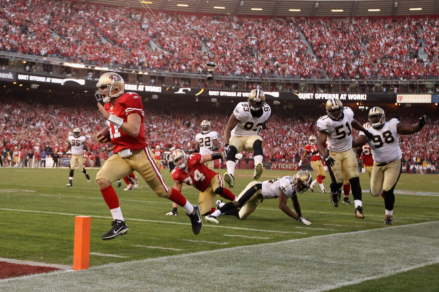 SAN FRANCISCO, CA - JANUARY 14: Alex Smith #11 of the San Francisco 49ers runs in for a touchdown a...