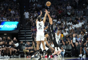 SACRAMENTO, CALIFORNIA - JULY 04: Darius Acuff Jr. #5 of the Sacramento Kings shoots over Ben Saraf #77 of the Brooklyn Nets during the first half in the California Classic a NBA Summer League game at Golden 1 Center on July 04, 2026 in Sacramento, California. NOTE TO USER: User expressly acknowledges and agrees that, by downloading and or using this photograph, User is consenting to the terms and conditions of the Getty Images License Agreement. (Photo by Thearon W. Henderson/Getty Images)