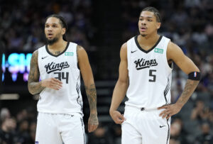 SACRAMENTO, CALIFORNIA - JULY 04: Darius Acuff Jr. #5 and Emanuel Sharp #34 of the Sacramento Kings looks on against the Brooklyn Nets during the second half in the California Classic a NBA Summer League game at Golden 1 Center on July 04, 2026 in Sacramento, California. NOTE TO USER: User expressly acknowledges and agrees that, by downloading and or using this photograph, User is consenting to the terms and conditions of the Getty Images License Agreement. (Photo by Thearon W. Henderson/Getty Images)