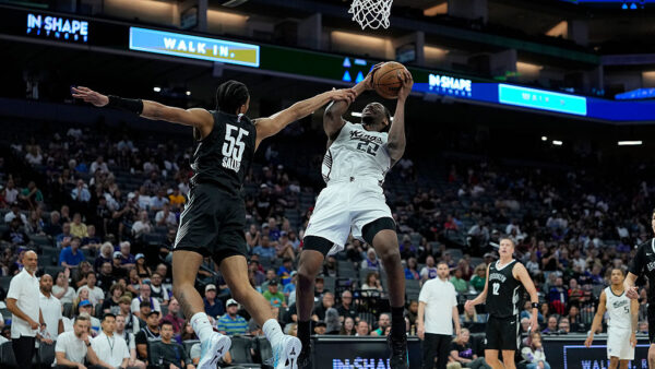 SACRAMENTO, CALIFORNIA - JULY 04: Jonathan Mogbo #22 of the Sacramento kings gets fouled on his shot by Hunter Sallis #55 of the Brooklyn Nets during the second half in the California Classic a NBA Summer League game at Golden 1 Center on July 04, 2026 in Sacramento, California. NOTE TO USER: User expressly acknowledges and agrees that, by downloading and or using this photograph, User is consenting to the terms and conditions of the Getty Images License Agreement. (Photo by Thearon W. Henderson/Getty Images)