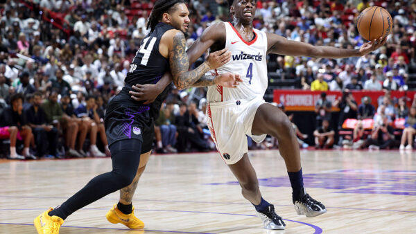 LAS VEGAS, NEVADA - JULY 12: AJ Dybantsa #4 of the Washington Wizards drives against Emanuel Sharp #34 of the Sacramento Kings in the second quarter of a Summer League game at the Thomas & Mack Center on July 12, 2026 in Las Vegas, Nevada. (Photo by Ian Maule/Getty Images)