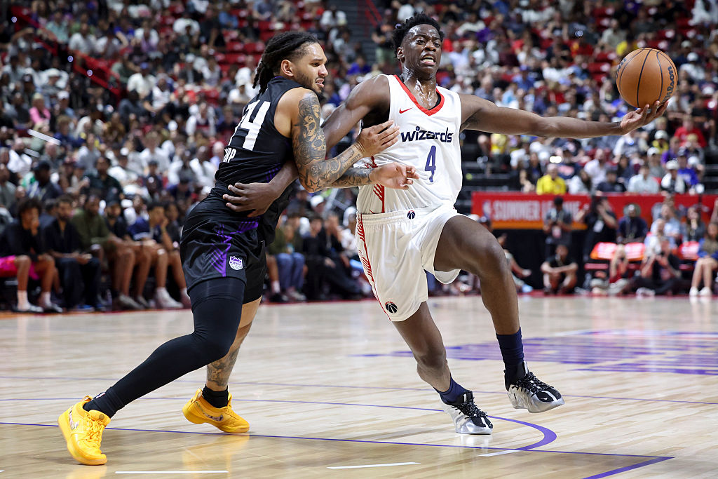 LAS VEGAS, NEVADA - JULY 12: AJ Dybantsa #4 of the Washington Wizards drives against Emanuel Sharp #34 of the Sacramento Kings in the second quarter of a Summer League game at the Thomas & Mack Center on July 12, 2026 in Las Vegas, Nevada. (Photo by Ian Maule/Getty Images)