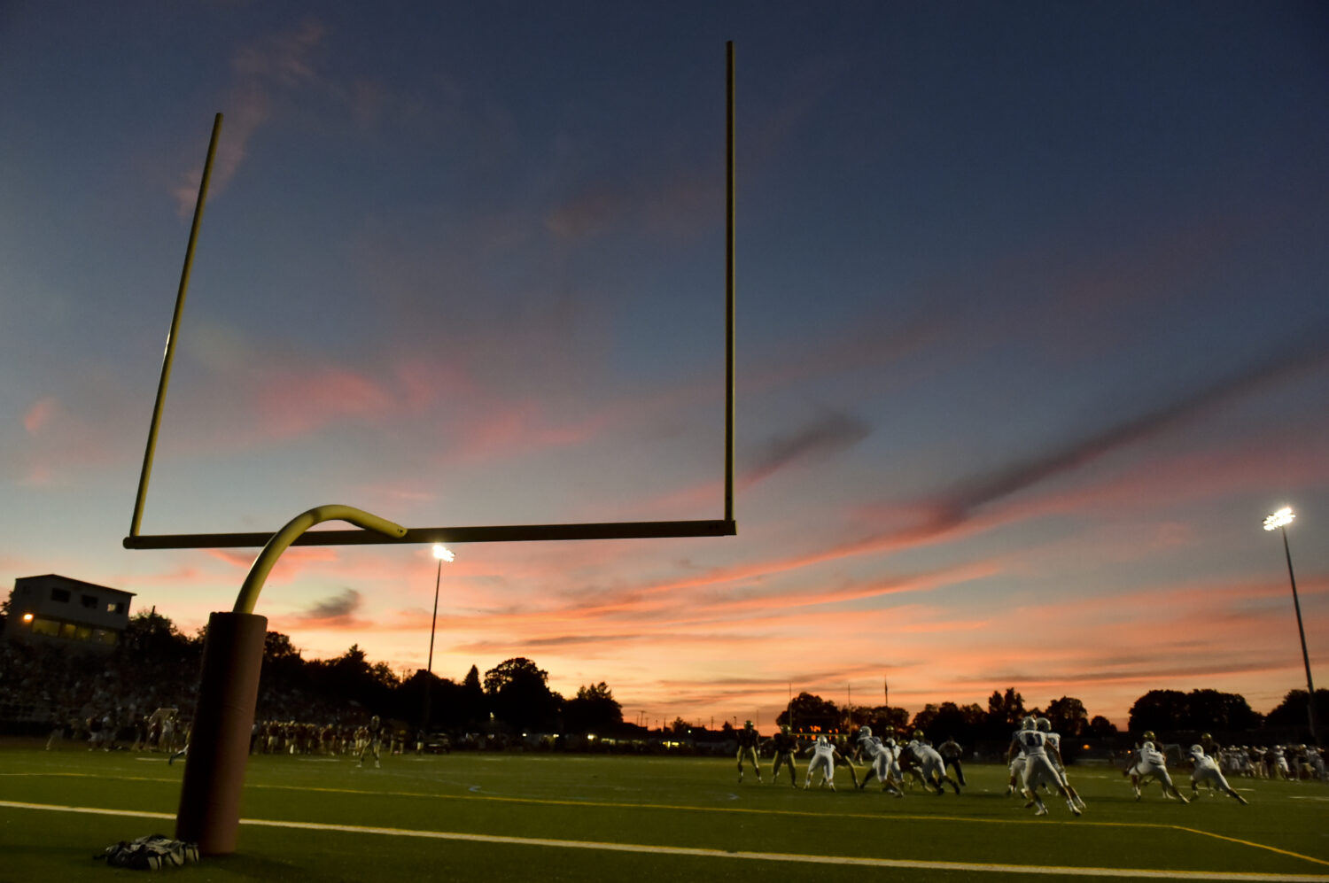 The sun sets behind the goal post. High School Football, the Exeter Eagles vs the Gov. Mifflin Must...