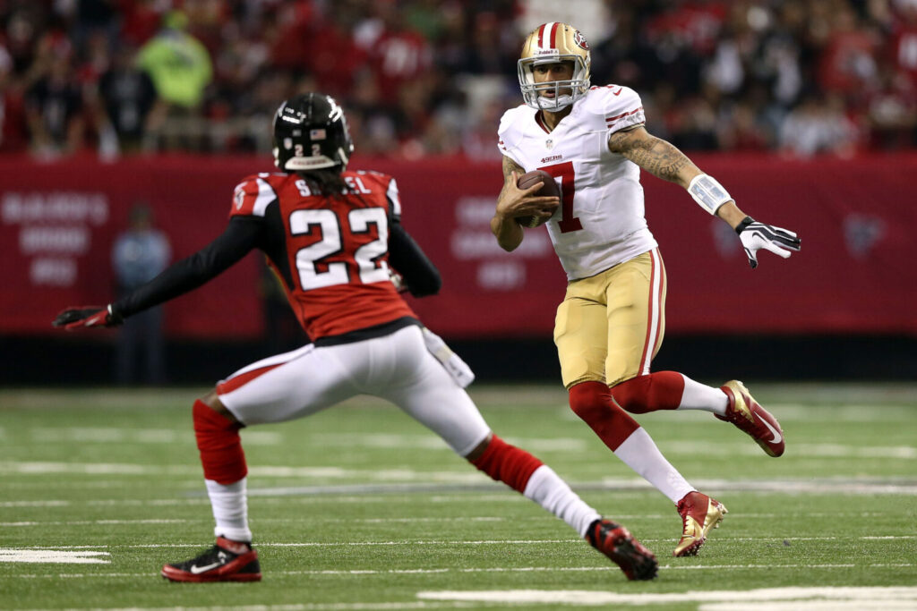 ATLANTA, GA - JANUARY 20: Quarterback Colin Kaepernick #7 of the San Francisco 49ers runs the ball against cornerback Asante Samuel #22 of the Atlanta Falcons in the second quarter in the NFC Championship game at the Georgia Dome on January 20, 2013 in Atlanta, Georgia. (Photo by Streeter Lecka/Getty Images)