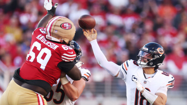 SANTA CLARA, CALIFORNIA - DECEMBER 08: Caleb Williams #18 of the Chicago Bears throws a pass over Evan Anderson #69 of the San Francisco 49ers during the third quarter at Levi's Stadium on December 08, 2024 in Santa Clara, California. (Photo by Ezra Shaw/Getty Images)