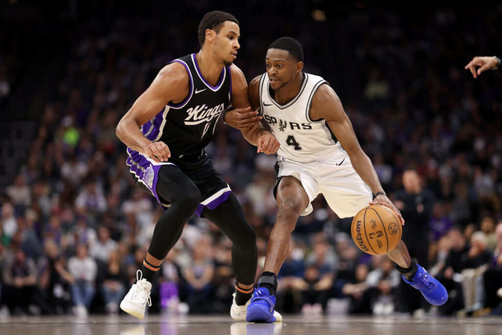 SACRAMENTO, CALIFORNIA - MARCH 07: De'Aaron Fox #4 of the San Antonio Spurs is guarded by Keegan Murray #13 of the Sacramento Kings at Golden 1 Center on March 07, 2025 in Sacramento, California. NOTE TO USER: User expressly acknowledges and agrees that, by downloading and/or using this photograph, user is consenting to the terms and conditions of the Getty Images License Agreement. (Photo by Ezra Shaw/Getty Images)