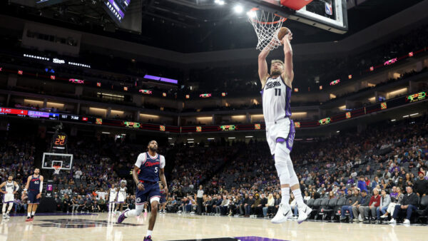 SACRAMENTO, CALIFORNIA - OCTOBER 15: Domantas Sabonis #11 of the Sacramento Kings goes up for a dunk on Derrick Jones Jr. #5 of the LA Clippers during their preseason game at Golden 1 Center on October 15, 2025 in Sacramento, California. NOTE TO USER: User expressly acknowledges and agrees that, by downloading and/or using this photograph, user is consenting to the terms and conditions of the Getty Images License Agreement. (Photo by Ezra Shaw/Getty Images)