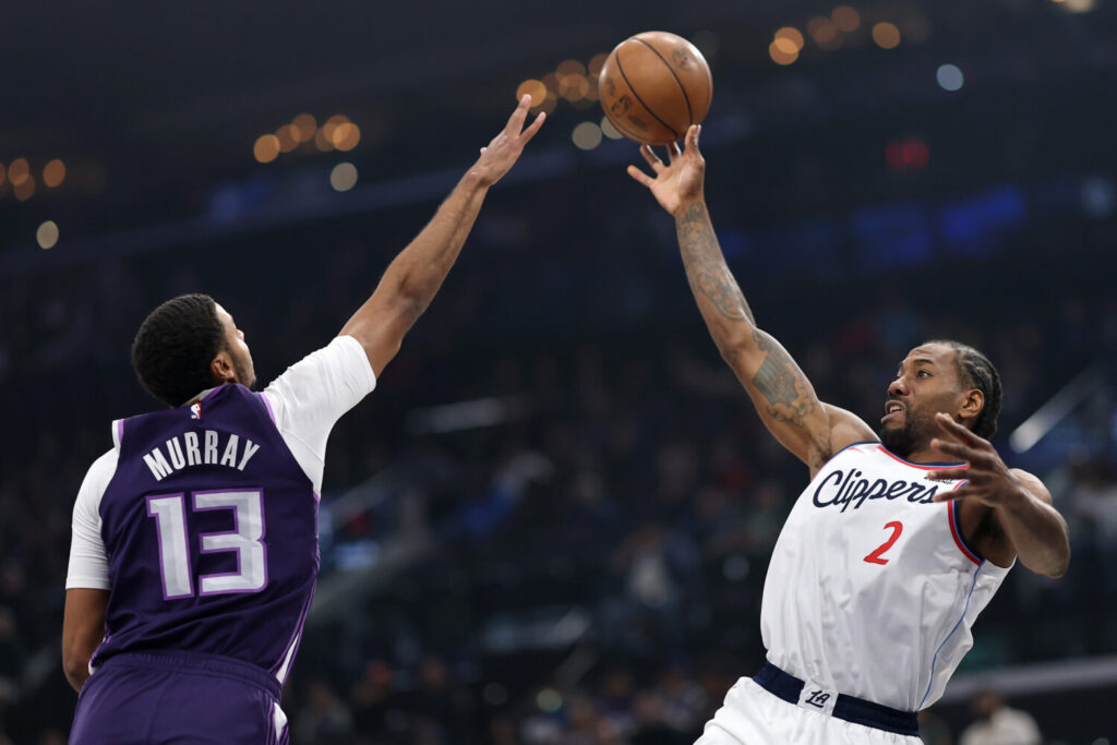 INGLEWOOD, CALIFORNIA - DECEMBER 30: Kawhi Leonard #2 of the Los Angeles Clippers shoots the ball against Keegan Murray #13 of the Sacramento Kings during the first quarter at Intuit Dome on December 30, 2025 in Inglewood, California. NOTE TO USER: User expressly acknowledges and agrees that, by downloading and or using this photograph, user is consenting to the terms and conditions of the Getty Images License Agreement. (Photo by Luke Hales/Getty Images)