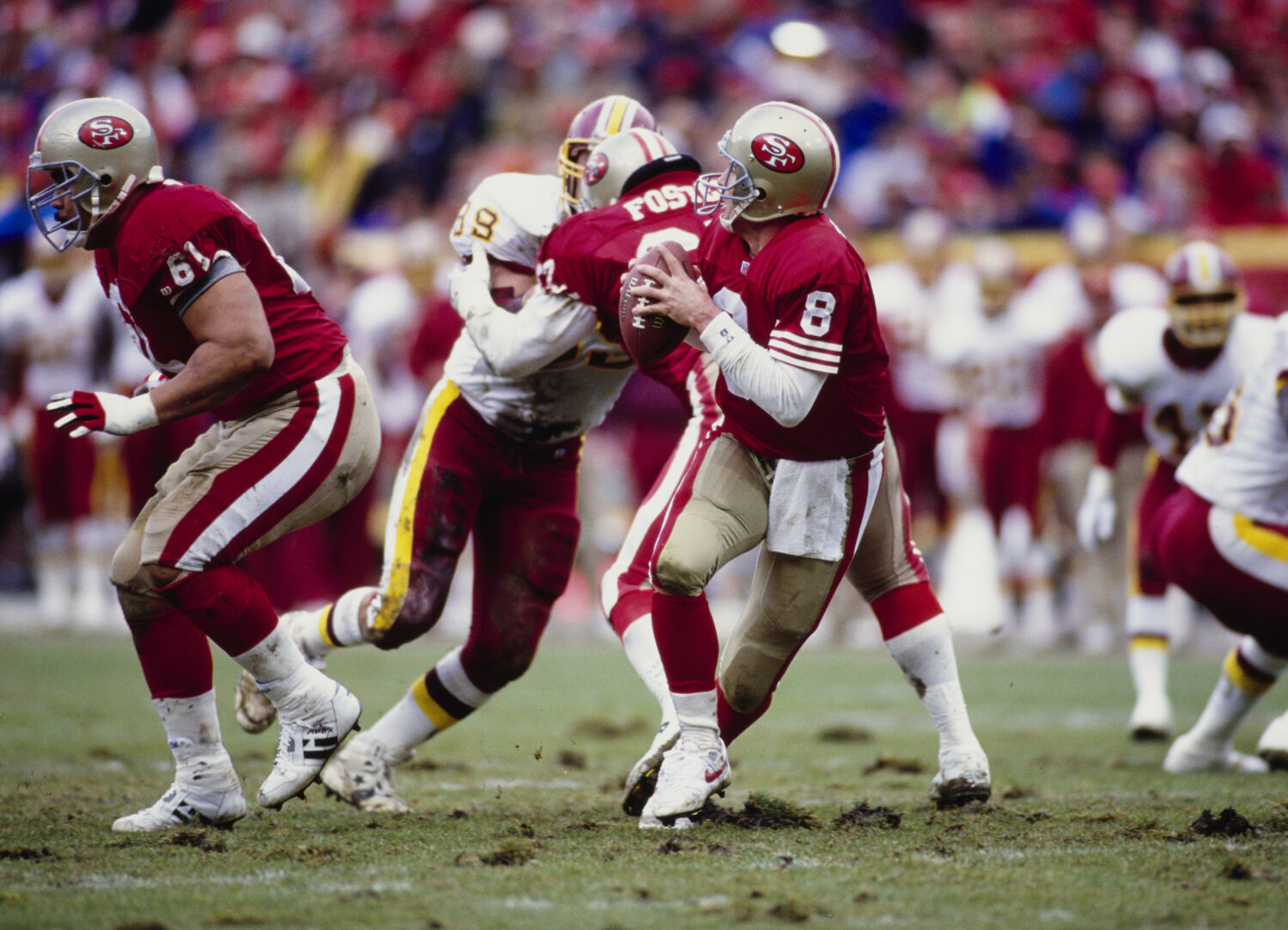 Steve Young #8, Quarterback for the San Francisco 49ers prepares to throw a pass upfield during the...