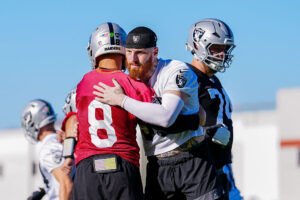 HENDERSON, NEVADA - JUNE 09: Maxx Crosby #98 and Kirk Cousins #8 of the Las Vegas Raiders embrace during mandatory minicamp at the Las Vegas Raiders Headquarters/Intermountain Health Performance Center on June 09, 2026 in Henderson, Nevada. (Photo by Louis Grasse/Getty Images)