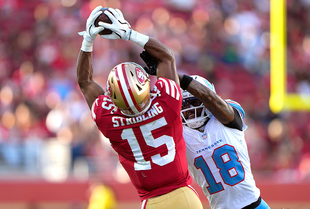 SANTA CLARA, CALIFORNIA - AUGUST 13: De'zhaun Stribling #15 of the San Francisco 49ers catches a deep pass over Cor'dale Flott #18 of the Tennessee Titans in the first half at Levi's Stadium on August 13, 2026 in Santa Clara, California. (Photo by Thearon W. Henderson/Getty Images)