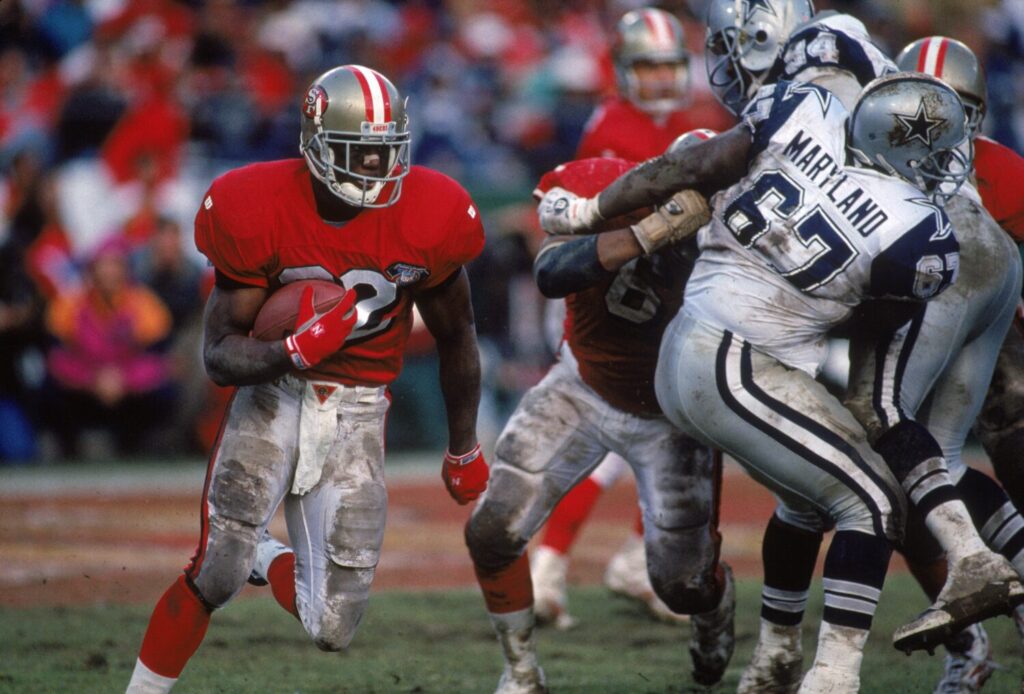 SAN FRANCISCO - JANUARY 15: Running back Ricky Watters #32 of the San Francisco 49ers runs with the ball during the 1994 NFC Championship game against the Dallas Cowboys at Candlestick Park on January 15, 1995 in San Francisco, California. The 49ers won 38-28. (Photo by George Rose/Getty Images)