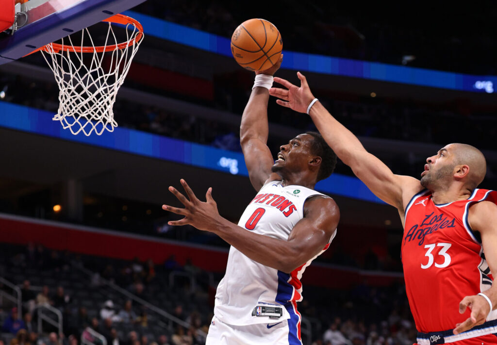 DETROIT, MICHIGAN - FEBRUARY 24: Jalen Duren #0 of the Detroit Pistons drives to the basket past Nicolas Batum #33 of the LA Clippers during the first half at Little Caesars Arena on February 24, 2025 in Detroit, Michigan. NOTE TO USER: User expressly acknowledges and agrees that, by downloading and or using this photograph, User is consenting to the terms and conditions of the Getty Images License. (Photo by Gregory Shamus/Getty Images)