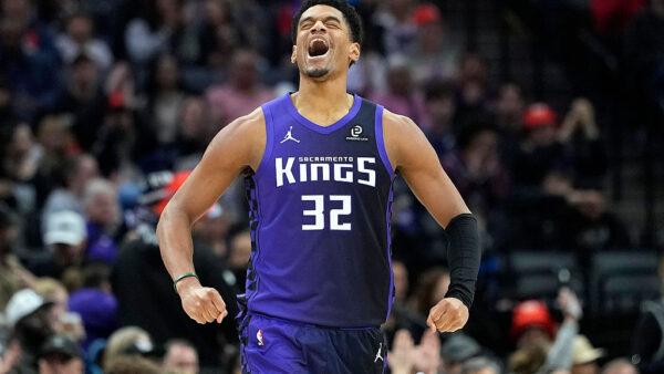SACRAMENTO, CALIFORNIA - DECEMBER 27: Dylan Cardwell #32 of the Sacramento Kings reacts after teammate Keon Ellis #23 made a three-point shot against the Dallas Mavericks in the second hal at Golden 1 Center on December 27, 2025 in Sacramento, California. NOTE TO USER: User expressly acknowledges and agrees that, by downloading and or using this photograph, User is consenting to the terms and conditions of the Getty Images License Agreement. (Photo by Thearon W. Henderson/Getty Images)