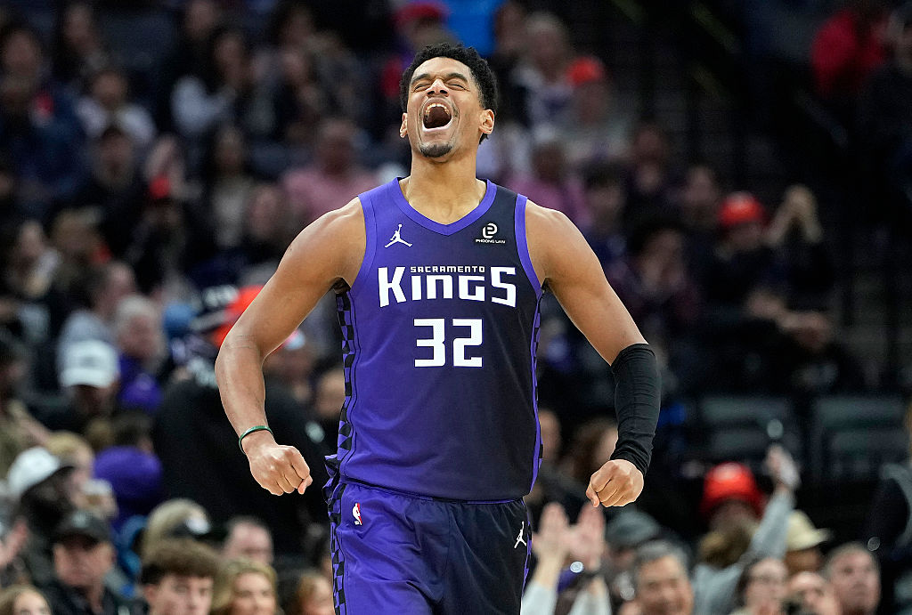 SACRAMENTO, CALIFORNIA - DECEMBER 27: Dylan Cardwell #32 of the Sacramento Kings reacts after teammate Keon Ellis #23 made a three-point shot against the Dallas Mavericks in the second hal at Golden 1 Center on December 27, 2025 in Sacramento, California. NOTE TO USER: User expressly acknowledges and agrees that, by downloading and or using this photograph, User is consenting to the terms and conditions of the Getty Images License Agreement. (Photo by Thearon W. Henderson/Getty Images)