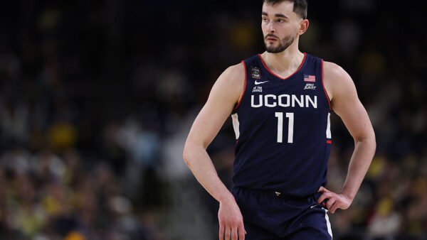 INDIANAPOLIS, INDIANA - APRIL 06: Alex Karaban #11 of the UConn Huskies looks on during the second half of a game against the Michigan Wolverines in the National Championship of the 2026 NCAA Men's Basketball Tournament at Lucas Oil Stadium on April 06, 2026 in Indianapolis, Indiana. (Photo by Michael Reaves/Getty Images)