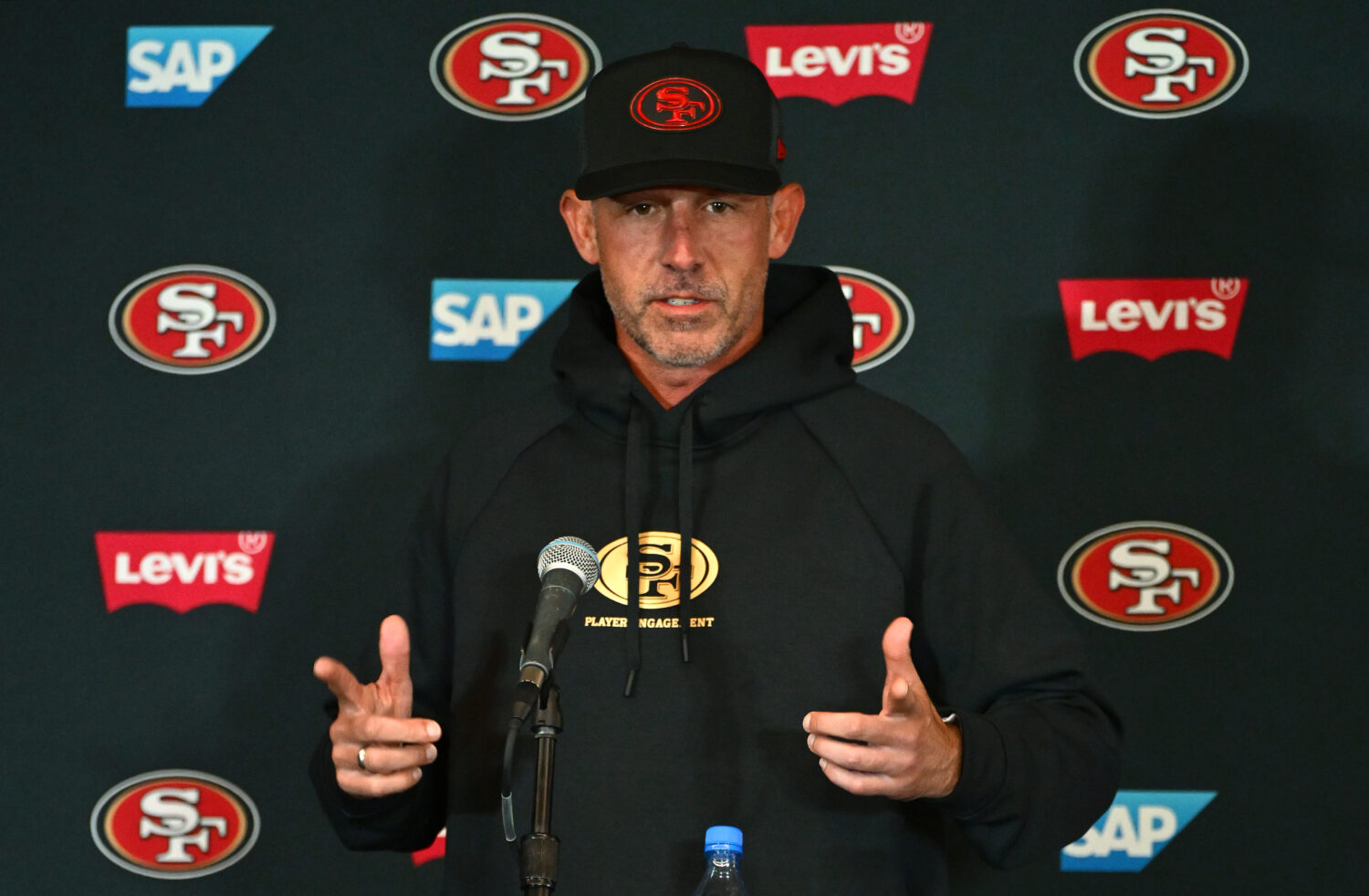 MELBOURNE, AUSTRALIA - SEPTEMBER 07: San Francisco 49ers Head Coach Kyle Shanahan talks to the medi...