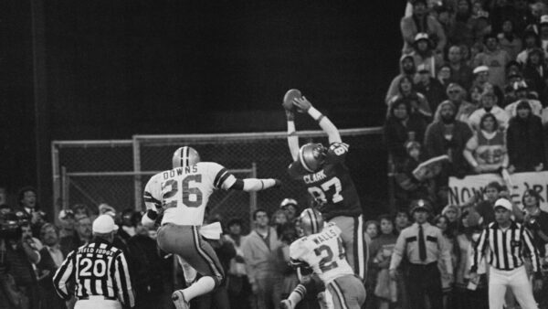 (Original Caption) San Francisco 49ers Dwight Clark (87, WR), goes up in the air in the end zone for the game-tying touchdown pass from Qb Joe Montana to set up the PAT which beat the Dallas Cowboys to give the 49ers their first NFC Championship and Super Bowl berth. At right is Cowboys Michael Downs (26, S) and at right Everson Walls (24, CB).