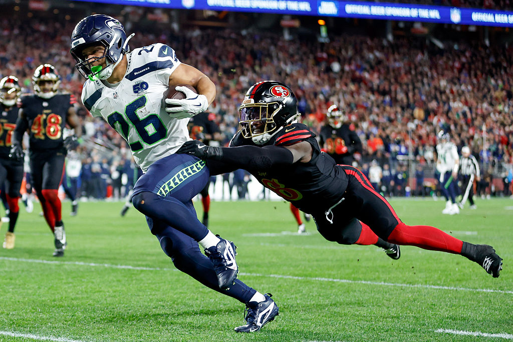 SANTA CLARA, CALIFORNIA - JANUARY 03: Zach Charbonnet #26 of the Seattle Seahawks scores a touchdow...